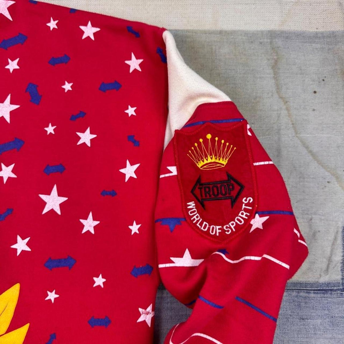 1990s Troop All Pro World of Sports Crest All Over Print Sweatshirt | Extra Large
