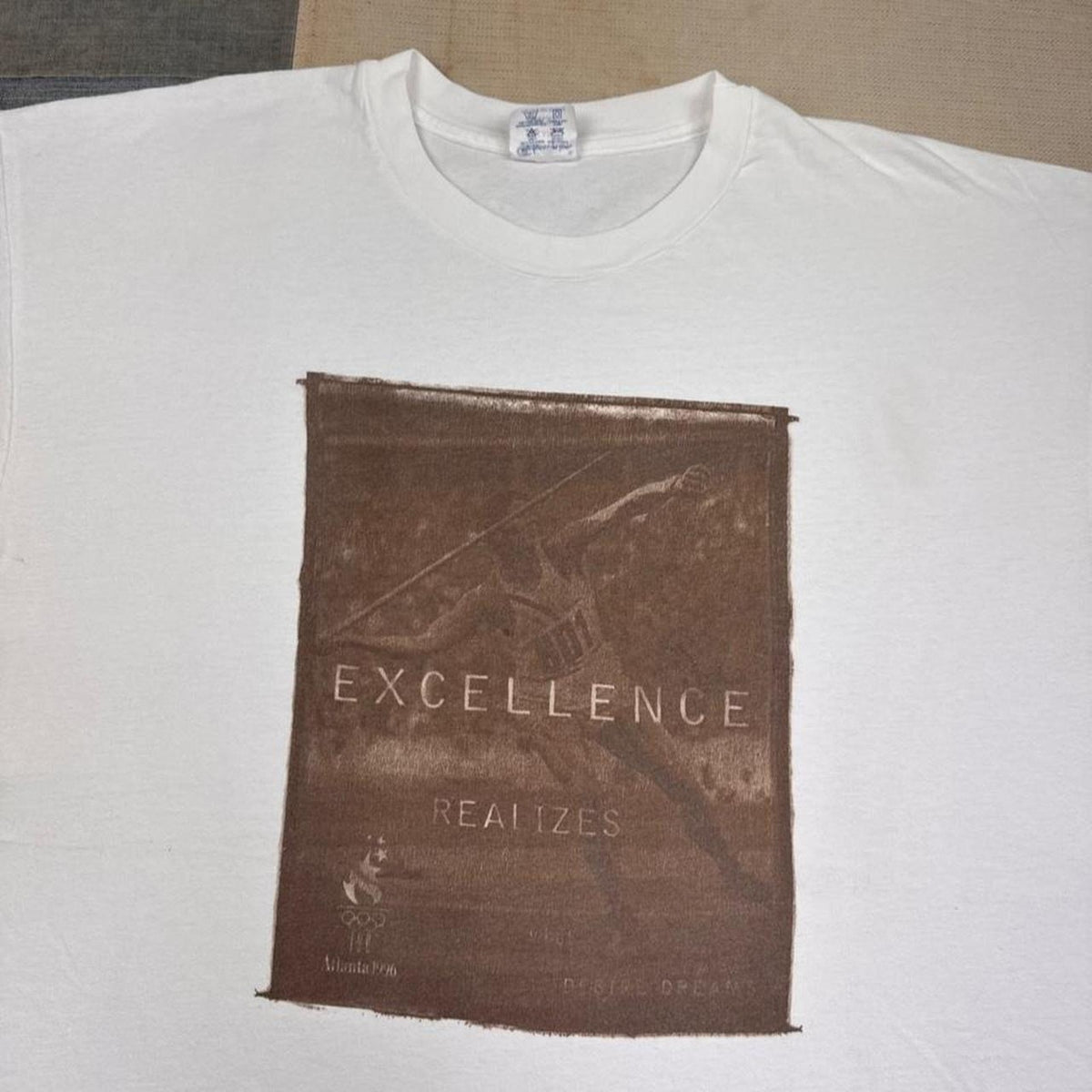 1996 Atlanta Olympics Champion Excellence Javelin Graphic Tee | XX-Large