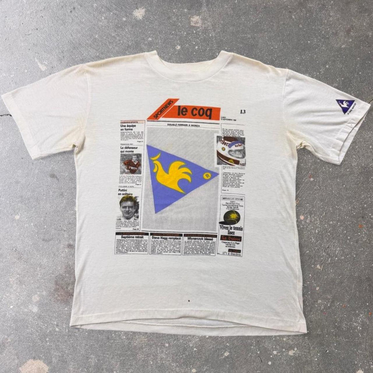 1990s Le Coq Sportif “Le Coq” Sports News Newspaper Graphic Tee | Large